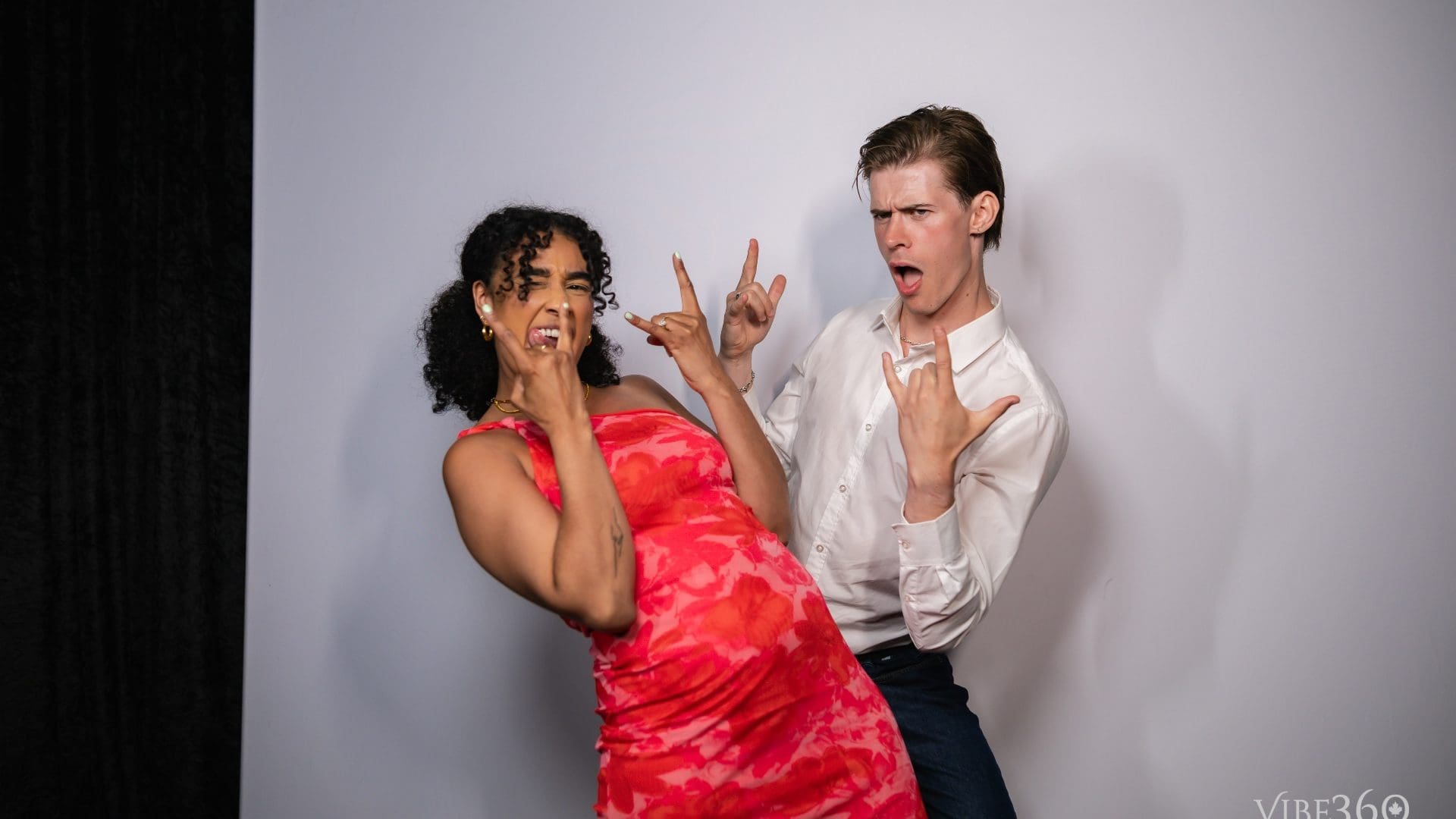 Party guests laughing inside a photo booth in Ottawa