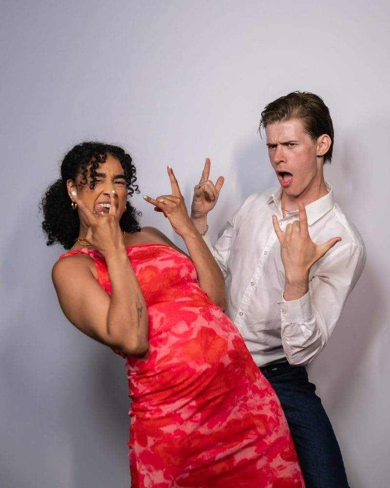 Party guests laughing inside a photo booth in Ottawa